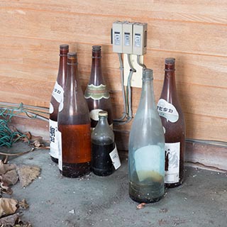 Bottles in Abandoned Book and Video Store in Murayama, Japan